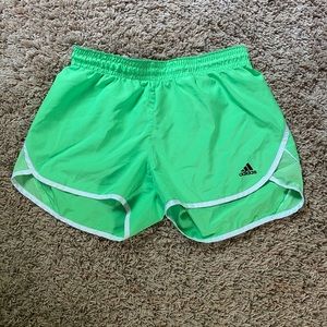 Green adidas athletic shorts